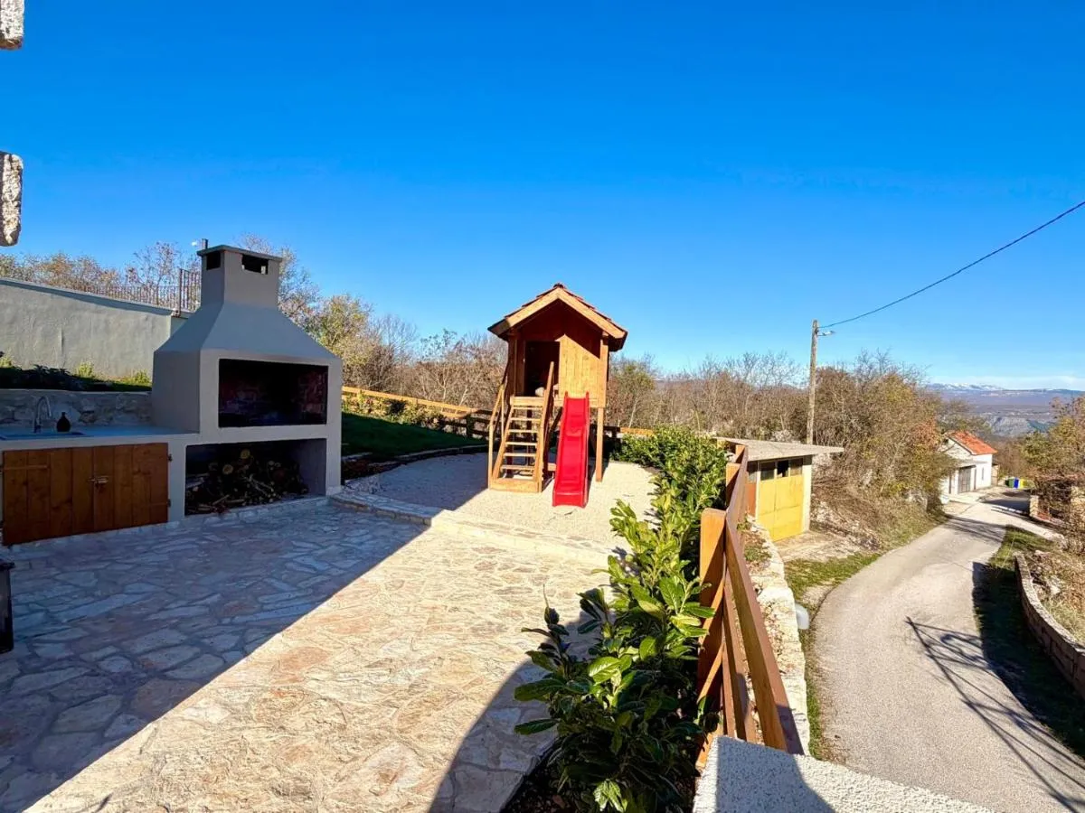 Barbecue terrace and children’s play area in daylight