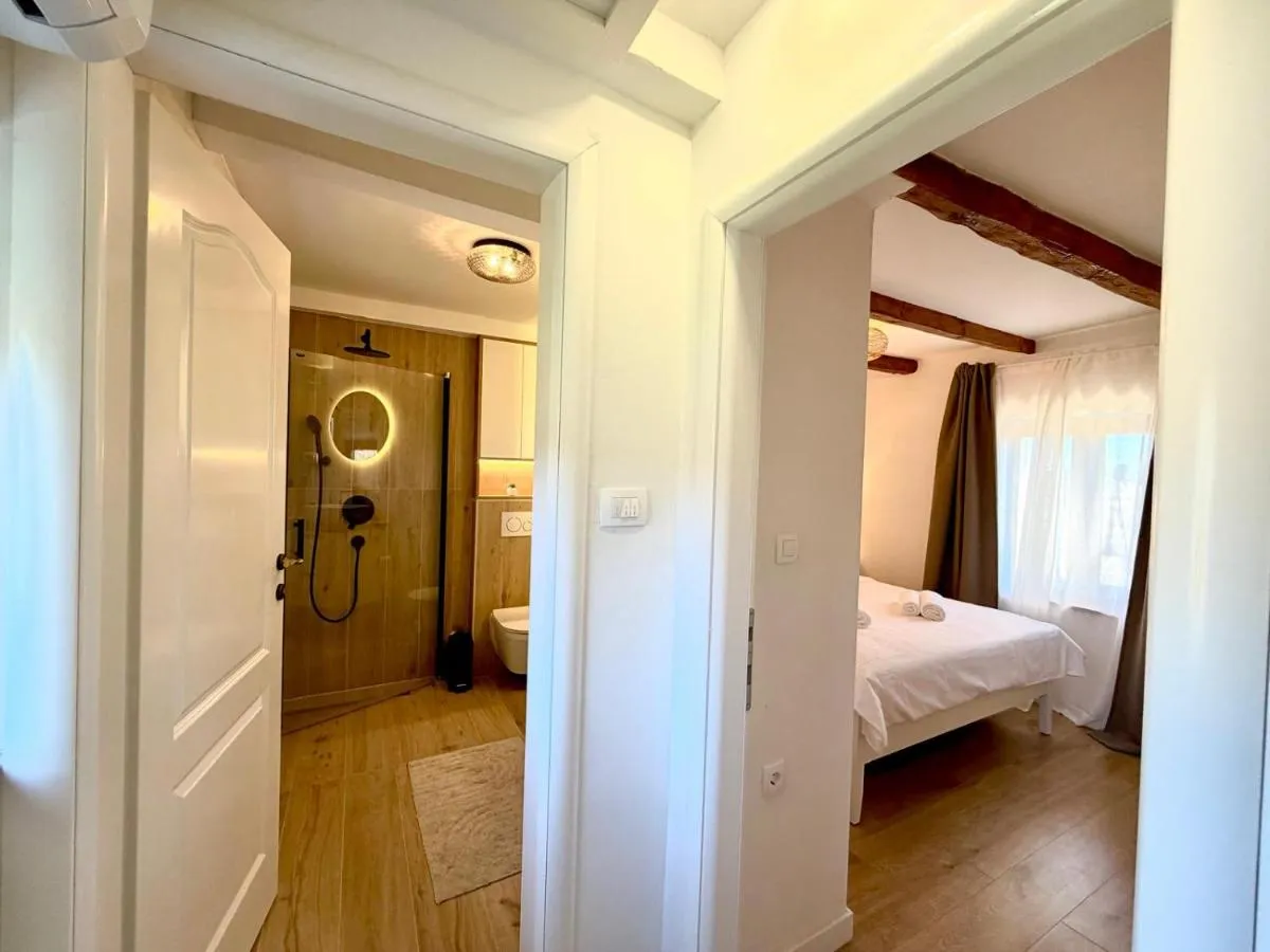 Bright hallway connecting the bedroom and bathroom