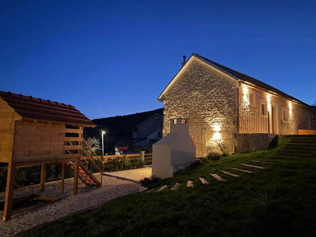 Villa Billubium and children’s playground after sunset