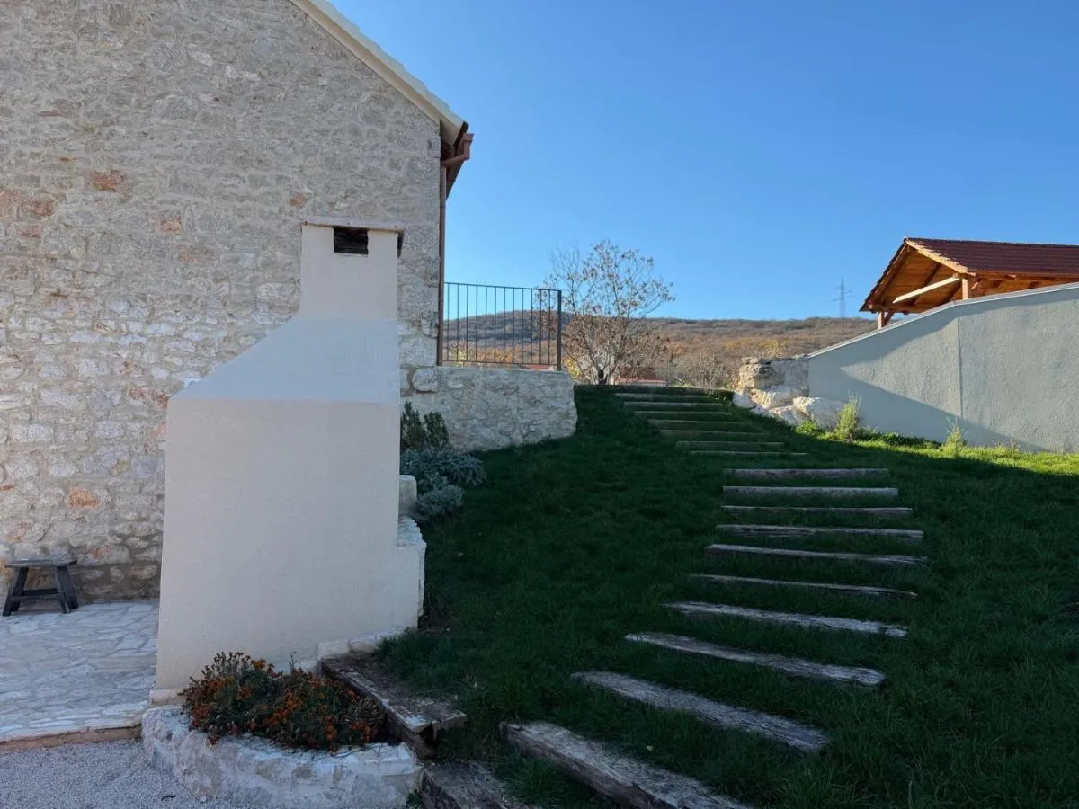 Garden steps leading alongside the traditional stone wall