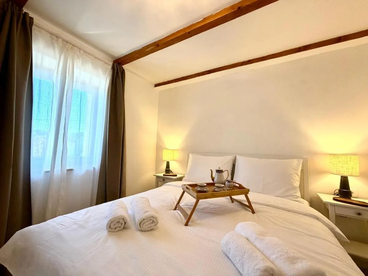 Relaxing bedroom with soft lighting and exposed beams